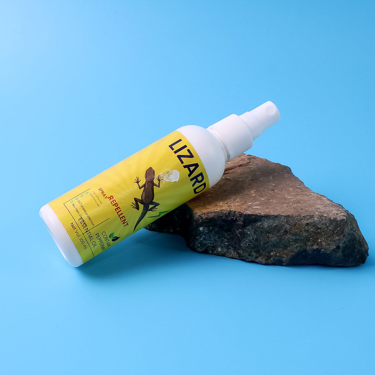 Close-up view of the lizard repellent spray bottle.
