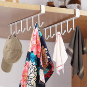 Under-shelf metal rack organizing kitchen utensils and tools
