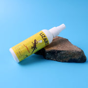Close-up view of the lizard repellent spray bottle.