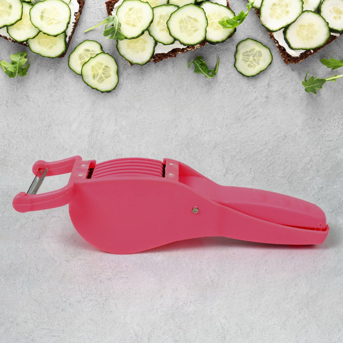 Multicolor 2-in-1 vegetable cutter and peeler for kitchen preparation.