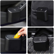 Plastic mini car trash can with durable lid design.