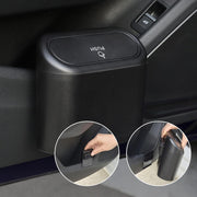 Mini car trash can with auto-rebound lid hanging inside vehicle