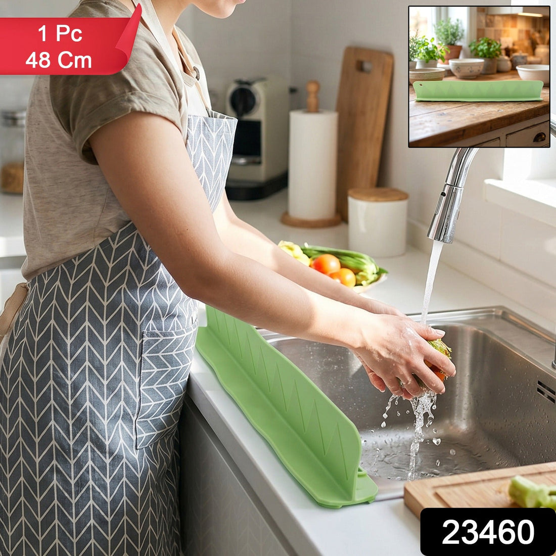 Flexible silicone kitchen sink splash guard protecting countertop during vegetable washing.
