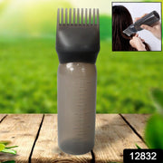 Close-up of the comb applicator brush and pump handle, showing fine bristles.